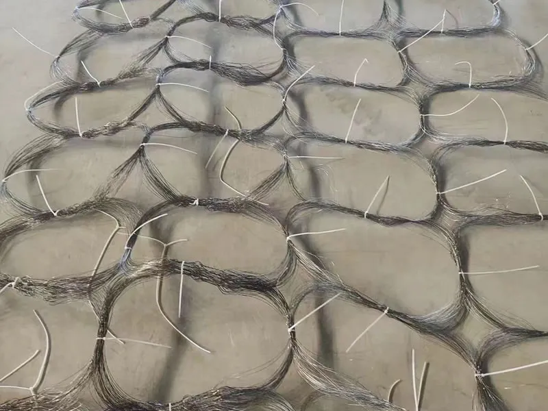 Rolls of anti-tank barrier net ready for transport and deployment